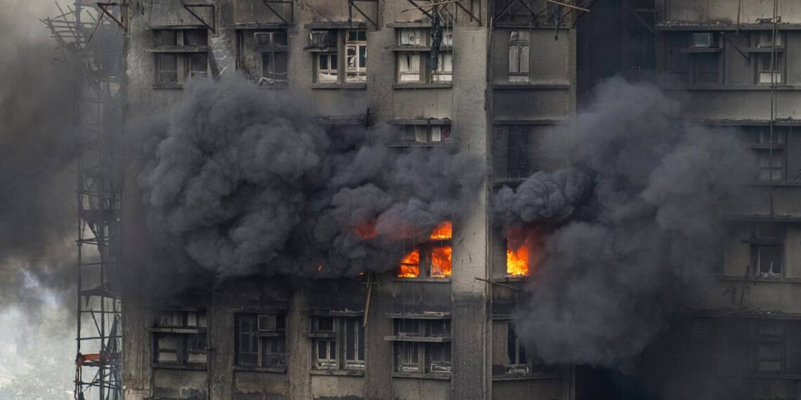 At least 75 dead as Hong Kong firefighters battle burning towers for second day