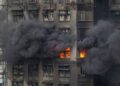 At least 75 dead as Hong Kong firefighters battle burning towers for second day At least 75 dead as Hong Kong firefighters battle burning towers for second day